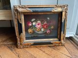 a picture of a painting of flowers in a vase on the floor