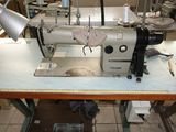 a sewing machine that is sitting on a table