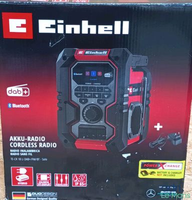 an image of a box with a radio in it sitting on the ground
