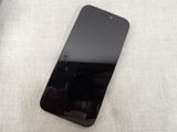 an image of a black cell phone sitting on top of a table