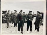 a black and white photo of a group of men in military uniforms