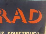 a sign that says rad on the side of a building