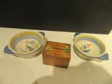 two bowls and a wooden box on a table