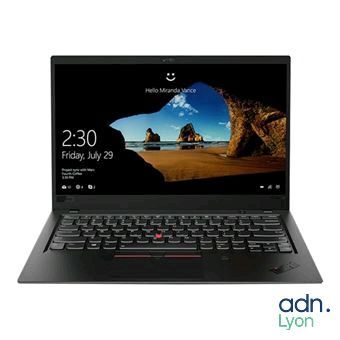 un ordinateur portable dont l'écran et le clavier sont noirs, posé sur une surface blanche