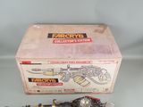 a box with a toy gun and a toy gun in it