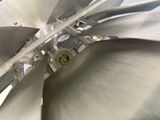 a close up view of a metal propeller on a plane