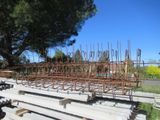 a large metal structure sitting on top of a cement slab