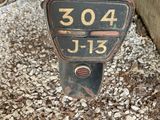 an old motorcycle with a number plate attached to it