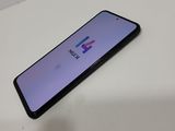 the back of an iphone with the logo on it sitting on a table