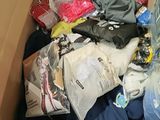 a box full of clothes and other items that are in it