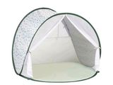 a white tent with a green trim on it