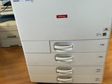 an image of a multi - function printer on a hard wood floor