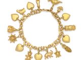 a gold charm bracelet with various charms on a white background