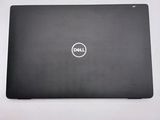 the dell laptop is sitting on a table with a white background