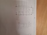 a drawing of a floor plan on a wooden table