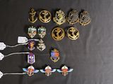 a lot of badges that are on a black table