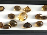 a lot of different colored stones in a black box