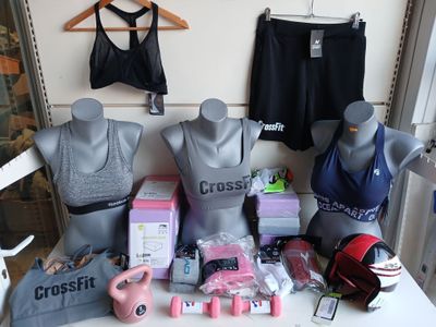 a table with a variety of sports bras on it
