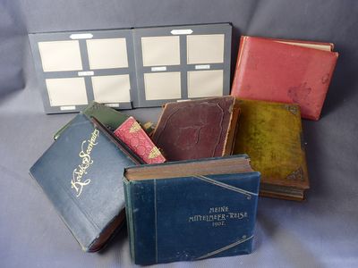 several old books are stacked on top of each other on a table