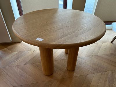a wooden table that has a sticker on it