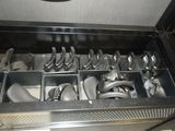 a drawer full of utensils and spoons in it