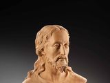 a carved bust of a man with a beard