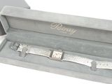 a watch that is in a box on the table