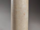 a close up of a vase on a table with a black background