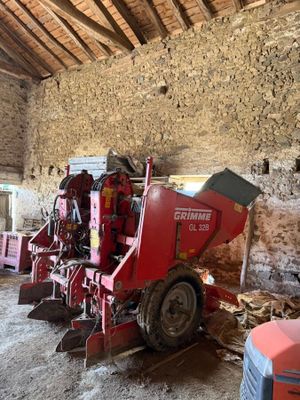 a red machine that is sitting inside of a building