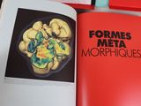 an open book with a picture of a plate of food on it