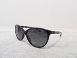 a pair of sunglasses sitting on a white surface