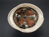a helmet that has a pair of shoes inside of it