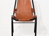 a brown leather chair with a black frame and black legs