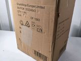 the box is sitting on the table next to the wall