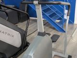a stationary exercise bike and a stationary exercise bike in a gym