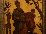 an old picture of a woman holding a child on a bench
