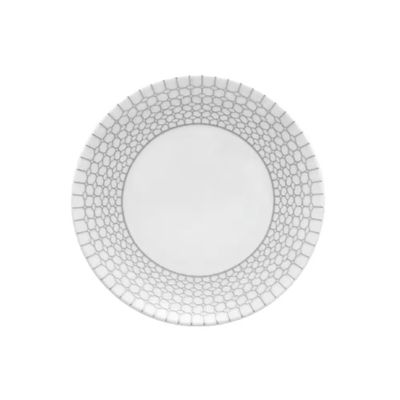 the plate is white and has a pattern on the rim