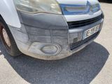 a white van that has been painted silver and is parked in a parking lot