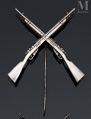 two guns are on a black surface with a black background