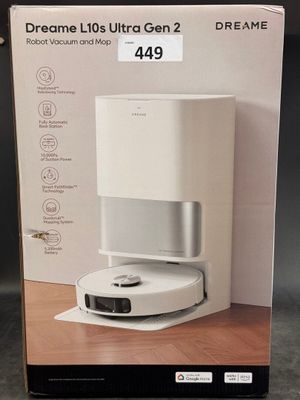 the box is open on a table with a coffee maker in it