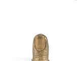 a close up of a gold statue of a person on a white background