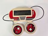 a small game console with a game controller attached to it