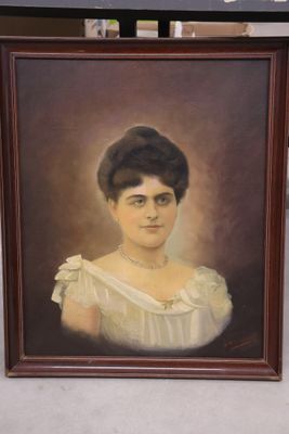 painting of a woman in a white dress in a brown frame