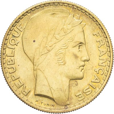 l'image d'une pièce d'or sur laquelle figure une tête de femme