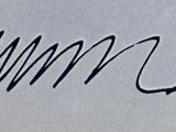 an image of a close up of a writing on a piece of paper