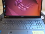 a laptop that is sitting on a desk with a sticky note on it