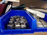 a blue container filled with assorted tools on top of a table