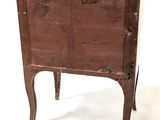 an old wooden chest sitting on top of a white floor