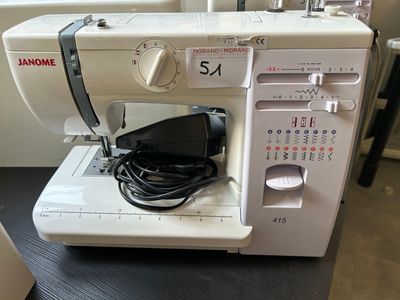 a sewing machine that is sitting on a table