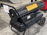 une photo d'un radiateur portable posé par terre